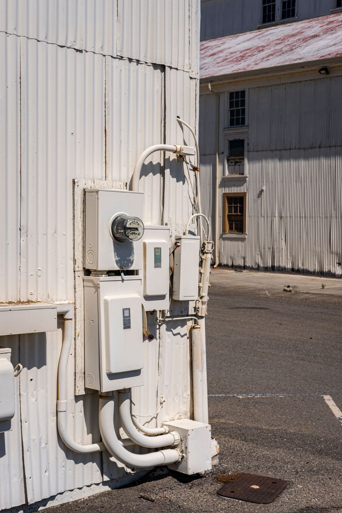 Electricity meters and service panels on the exterior of a home
