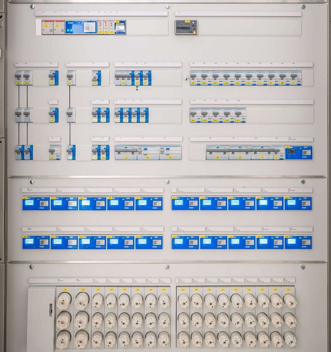 Modern electrical panel with rows of circuit breakers, the kind installed during a 200-amp service upgrade